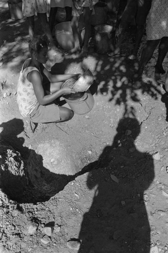 Girl collecting water at river, San Basilio de Palenque, ca. 1978