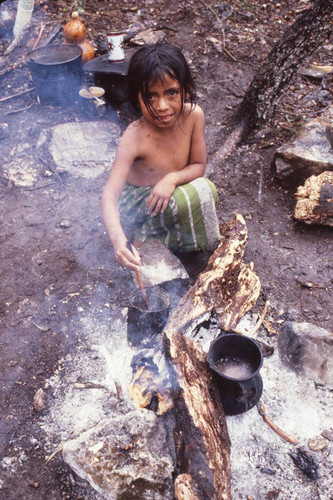 Guatemalan refugee girl cooks, La Sombra, ca. 1983