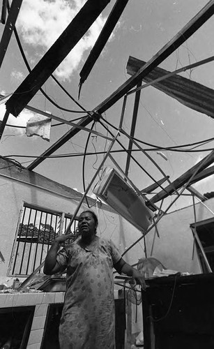 Woman in destroyed home, Nicaragua, 1979