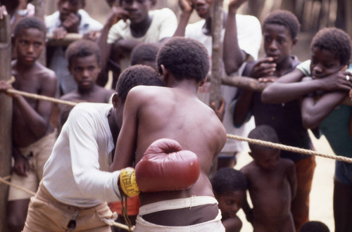 Boys boxing inside a ring, San Basilio de Palenque, 1976