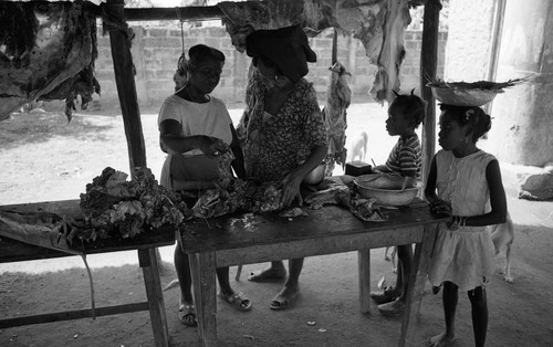 Women selling and buying meat, San Basilio de Palenque, 1976