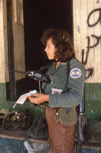 Woman guerrilla with radio, San Agustín, 1983