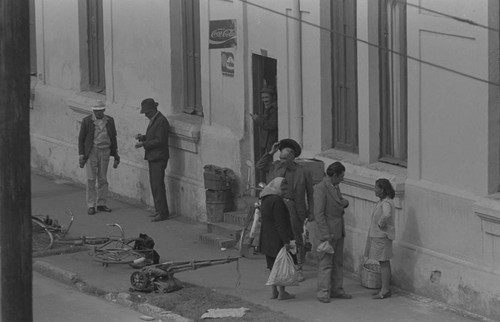 A group of men and women socializing, Bogotá, Colombia, 1976