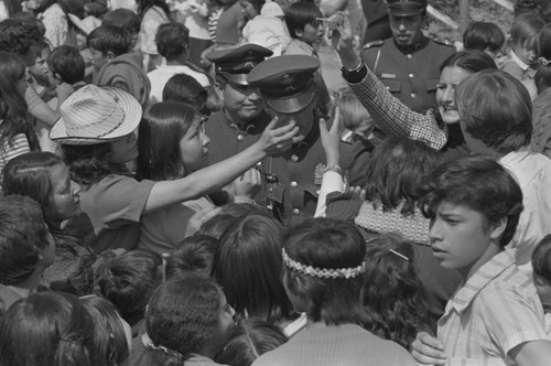 Officers amongst a crowd, Tunjuelito, Colombia, 1977