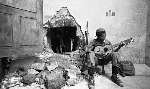 Sandinista plays guitar, Nicaragua, 1979