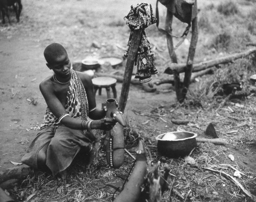 Maasai villager holding a container, Tanzania, 1979