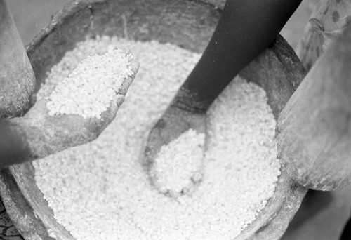 Hands processing corn, San Basilio de Palenque, 1977