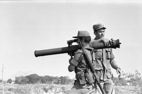 A U.S. military advisor training a Salvadoran soldier at Ilopango Military Base, Ilopango, 1983