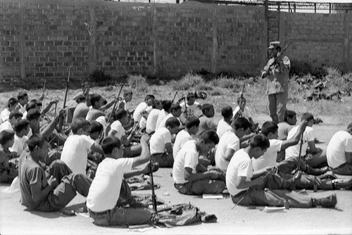 U.S. military advisor training Salvadoran soldiers, Ilopango, 1983