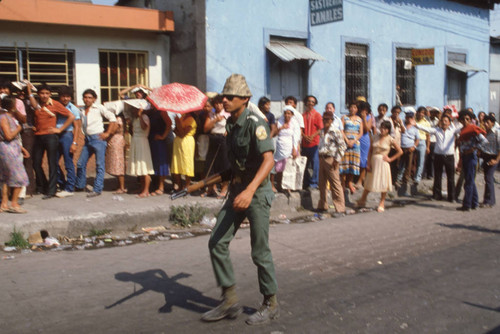 Soldier patrolling on election day, Santa Tecla, El Salvador, 1982