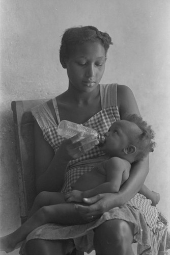 Woman feeding a baby, San Basilio de Palenque, 1977