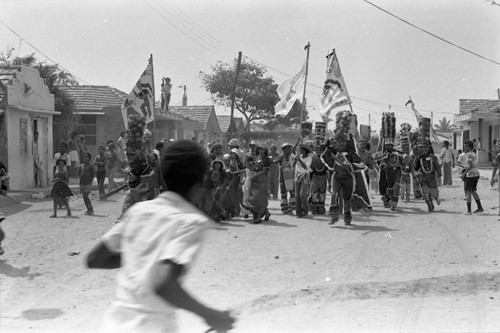 Dancers walking to the Carnival, Barranquilla, Colombia, 1977