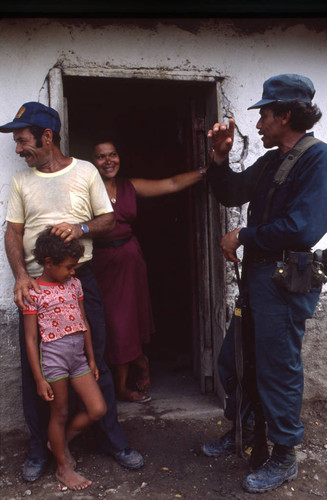 Contra soldier with people, Honduras, 1983