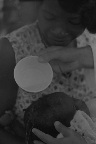 Child being baptized, San Basilio de Palenque, 1975