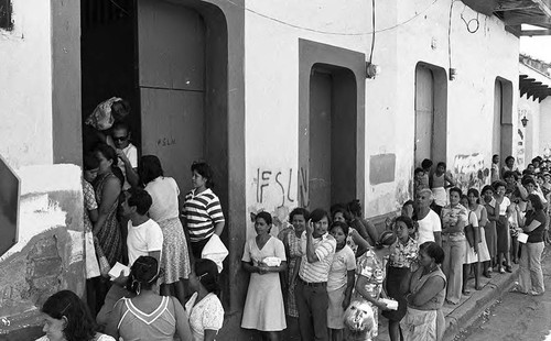 People wait in line outside of a building, Nicaragua, 1979