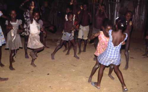 Girls boxing outdoors, San Basilio de Palenque, 1976