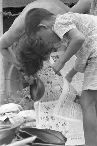 Wrapping clay pieces, La Chamba, Colombia, 1975