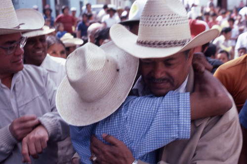 Presidential candidate Ángel Aníbal Guevara hugged by admirer, Ciudad Vieja, 1982