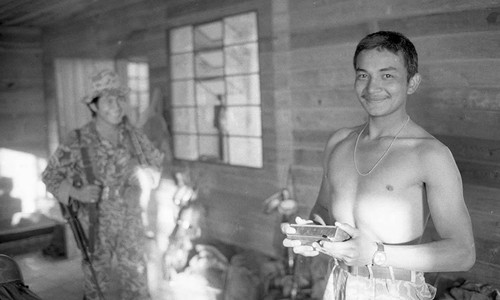 Young soldiers inside a house, Guatemala, 1982