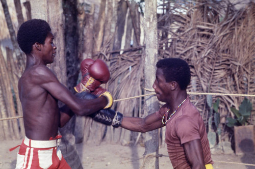 Men boxing in boxing ring, San Basilio de Palenque, 1976