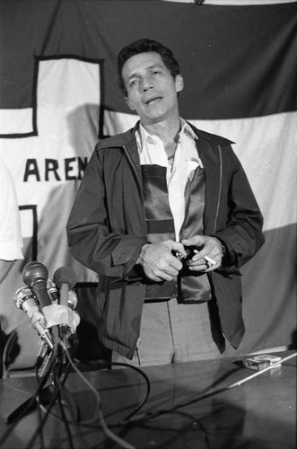 Roberto D'Aubuisson speaks with a cigarette in hand, San Salvador, 1982