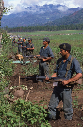 Six Contra soldiers line up side by side, Nicaragua, 1983