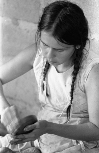 Woman crafting a clay bowl, La Chamba, Colombia, 1975