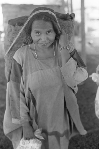 Woman carries bag on head, La Guajira, Colombia, 1976