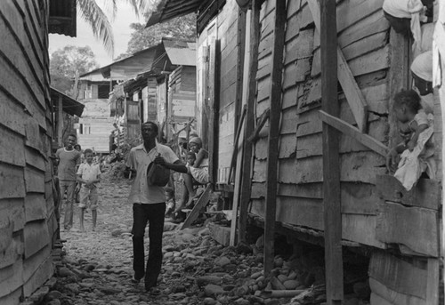 A man and his drum in an alley, Barbacoas, Colombia, 1979