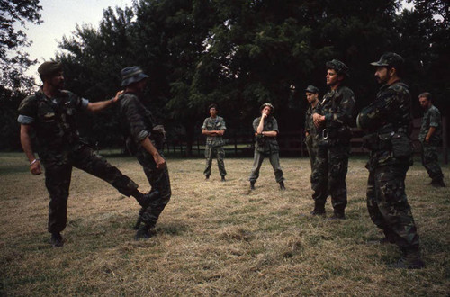 Camp instructor demonstrates combat techniques, Liberal, 1982