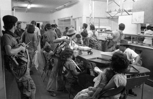 Sandinistas eat at a hotel, Managua, 1979