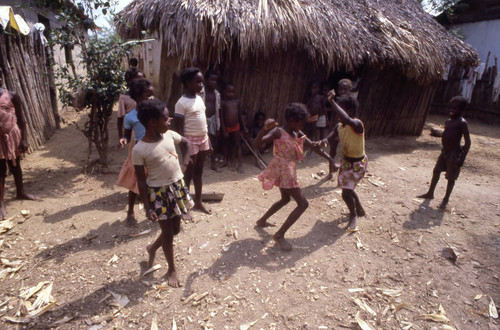 Girls boxing outdoors, San Basilio de Palenque, 1976