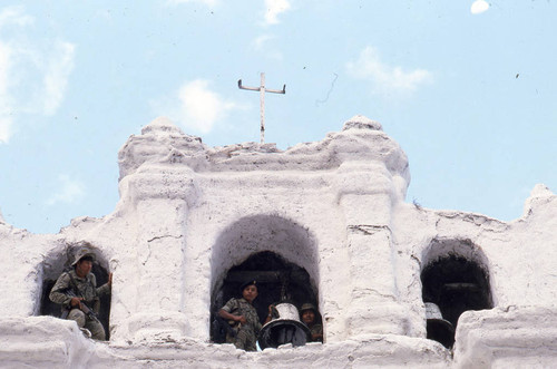 Soldiers on guard in a church belfry, Chajul, 1982