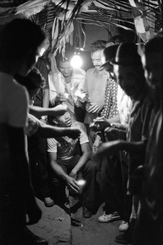 Men celebrating in the evening, Barranquilla, Colombia, 1977