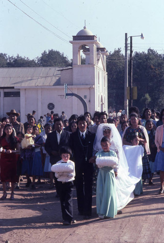 A young bride and groom with their wedding guests, Chiquimula, 1982