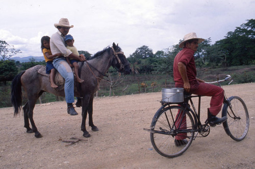 Man on horse and man on bicycle, Honduras, 1983