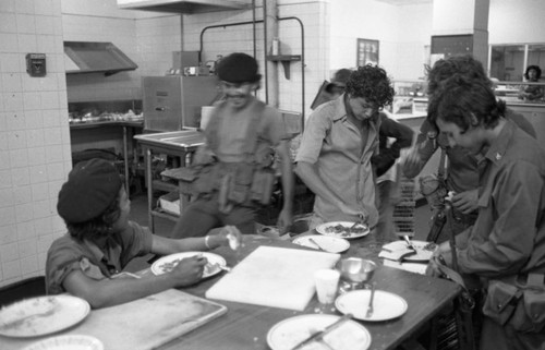 Sandinistas eat at a hotel, Managua, 1979