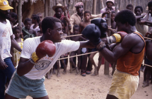 Boxers fighting inside boxing ring, San Basilio de Palenque, 1976