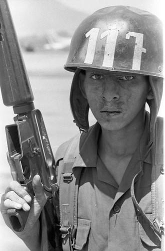 Guatemalan soldier at military base, Ilopango, 1983