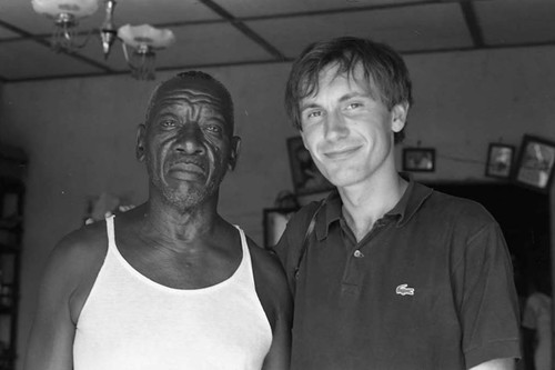 Richard Cross and Fermin Herrera inside of a home, San Basilio de Palenque, 1975