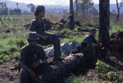 Three Contra soldiers rest at El Porvenir Farm, Nicaragua, 1983