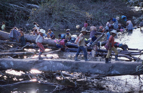 Guatemalan refugee women and children wash themselves and their clothes in the rive, Puerto Rico, 1983