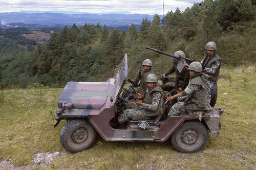 Five arrmed soldiers in a jeep on patrol, Guatemala, 1982