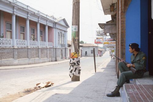 Soldier sitting while on guard, Usulután, El Salvador, 1982