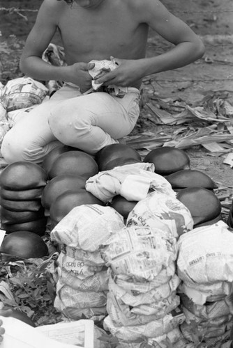 Wrapping clay pieces, La Chamba, Colombia, 1975