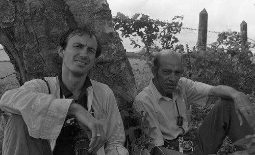 Richard Cross sits next to another photographer, Nicaragua, 1979