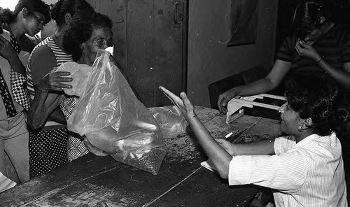 Woman with a bag of beans, Nicaragua, 1979