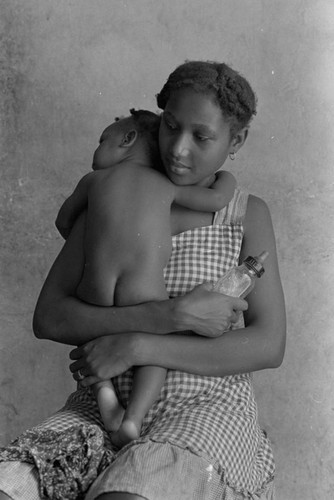 Woman holding a baby, San Basilio de Palenque, 1976