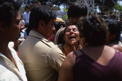 A woman is consoled, Nicaragua, 1983