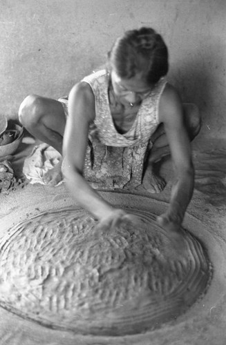 A woman making pottery, La Chamba, Colombia, 1975